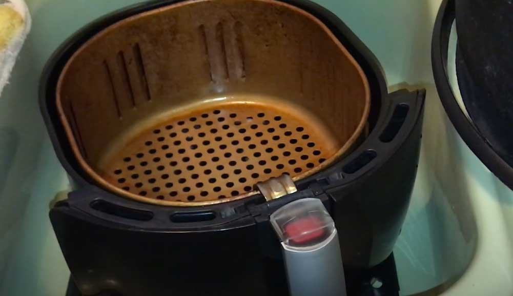 How to clean stuck on grease from air fryer basket